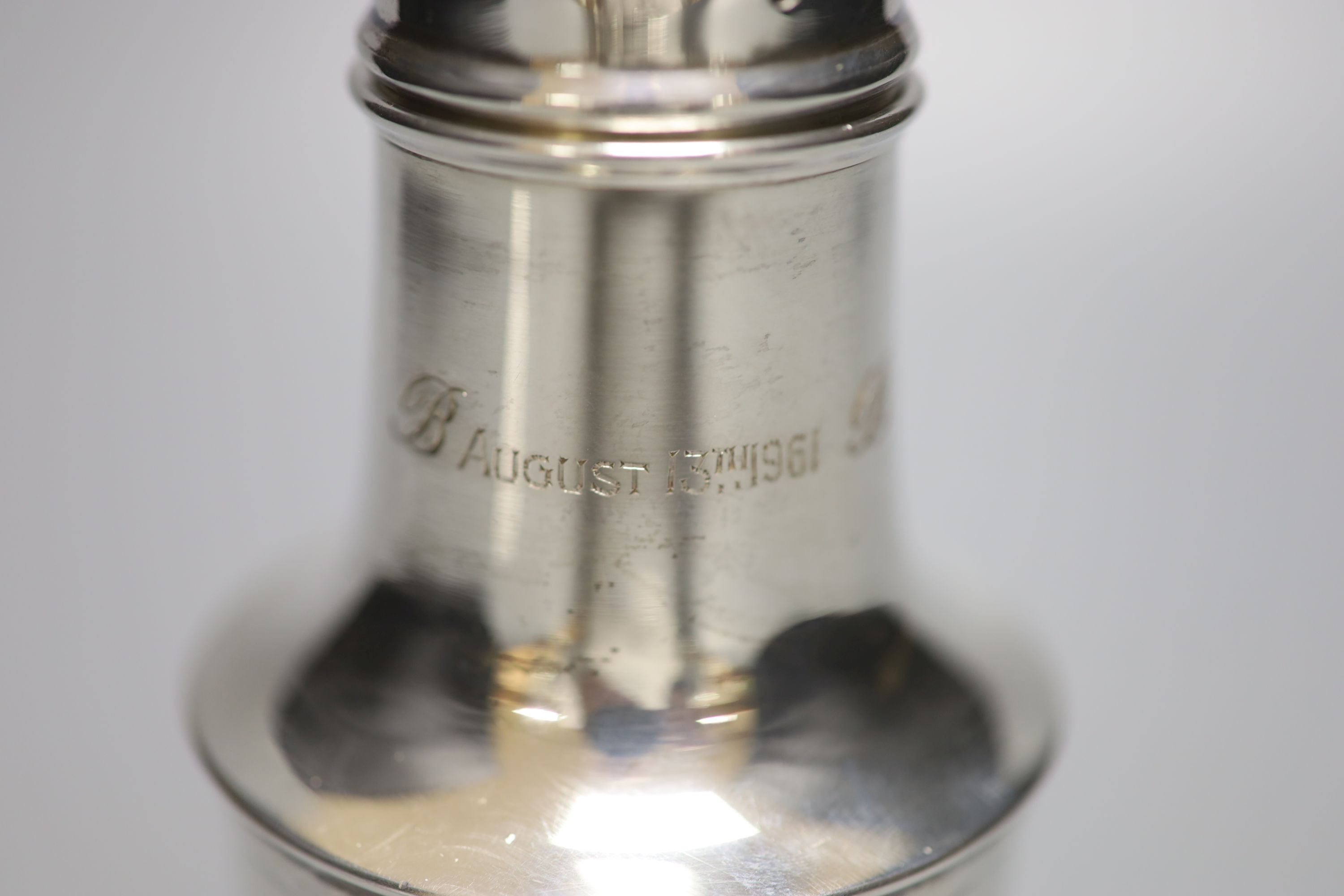 A 1960s silver sugar caster, with engraved inscription, 18cm, 4.5oz (a.f.).